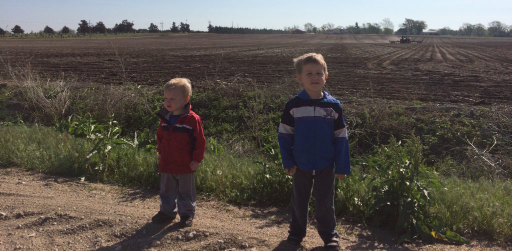 April 2016, watching a tractor plant the field.
